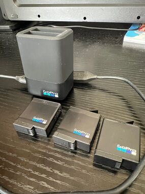 GoPro Dual Battery Charger and Three Black GoPro Batteries